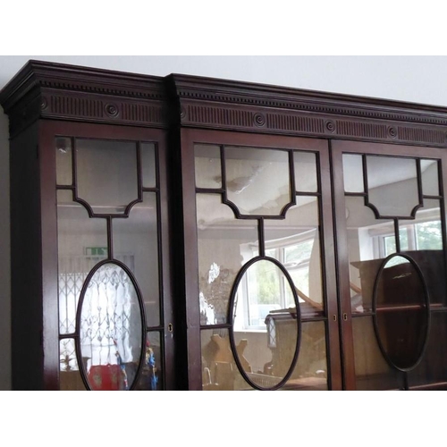 903 - A very fine late 18th century breakfront mahogany library secretaire bookcase; the dentil cornice ab... 