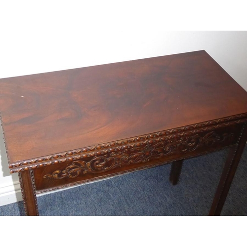 915 - A mid 18th century mahogany fold over top card table; the figured top above the two edges opening to... 