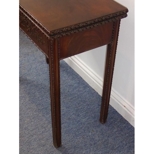 915 - A mid 18th century mahogany fold over top card table; the figured top above the two edges opening to... 