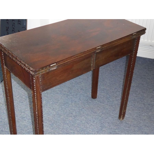 915 - A mid 18th century mahogany fold over top card table; the figured top above the two edges opening to... 