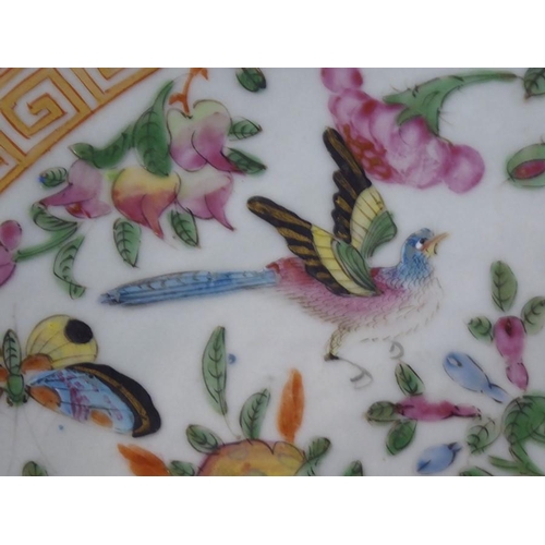 92 - A 19th century Chinese Canton porcelain charger; hand-decorated in the famille rose palette; the bor... 