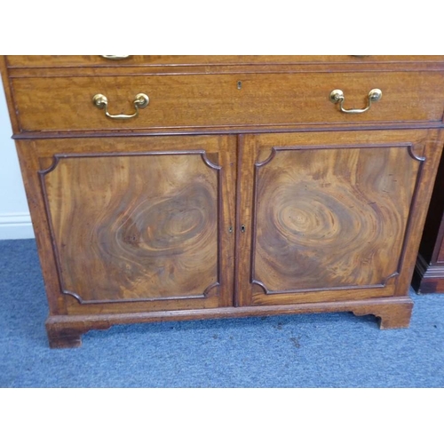 928 - An 18th century mahogany secretaire bookcase; the broken swan-neck pediment pierced in open fretwork... 