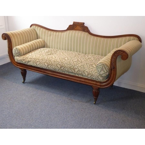 940 - A late Regency period/early Victorian rosewood-framed and upholstered sofa; scrolling ends carved wi... 