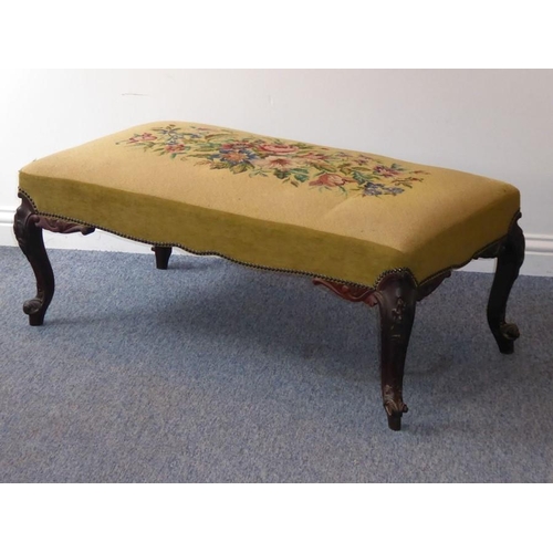 941 - A mid-19th century upholstered long stool; a later floral needlework upholstered top above a rosewoo... 