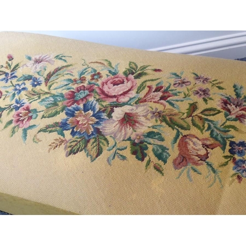 941 - A mid-19th century upholstered long stool; a later floral needlework upholstered top above a rosewoo... 