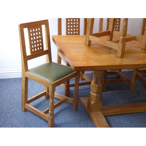 946 - A fine Robert 'Mouseman' Thompson of Kilburn refectory dining table together with six lattice back c... 