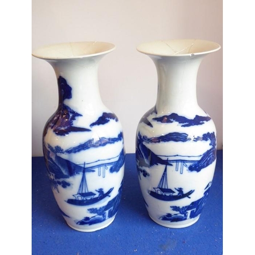 96 - A pair of 19th century Chinese porcelain blue-and-white vases, both with damage to tops but all piec... 