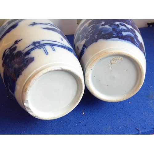 96 - A pair of 19th century Chinese porcelain blue-and-white vases, both with damage to tops but all piec... 