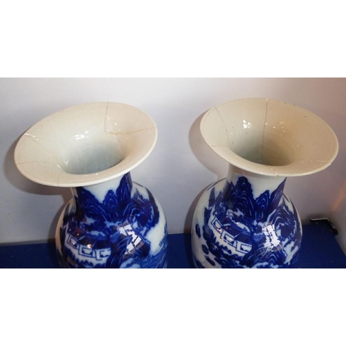 96 - A pair of 19th century Chinese porcelain blue-and-white vases, both with damage to tops but all piec... 