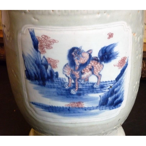 99 - A 19th century Chinese porcelain vase; the wide circular rim above a waisted neck with incised key f... 