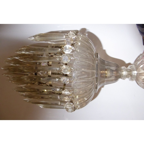 100H - A late 19th/early 20th century heavy crystal chandelier having cut-glass faceted droplets (possible ... 