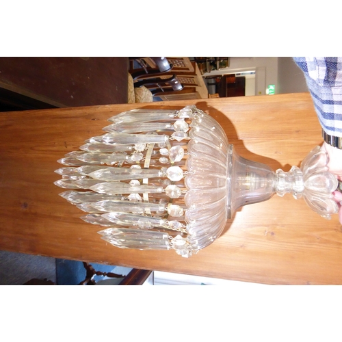 100H - A late 19th/early 20th century heavy crystal chandelier having cut-glass faceted droplets (possible ... 