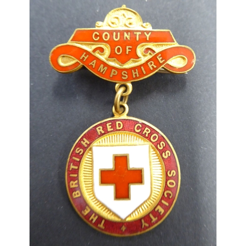 742 - A selection of enamel Red Cross and other awards and badges, one marked 'Zoe Beaver'; together with ... 