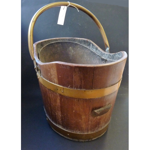 546 - A 19th century brass-bound, heavy mahogany pail with swing handle and applied front brass grip toget... 