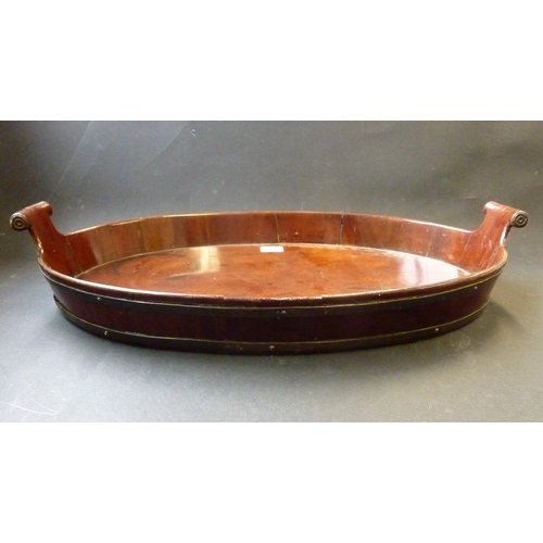 566 - An 18th century style oval mahogany two-handled serving tray coopered with two brass bands, small ci... 