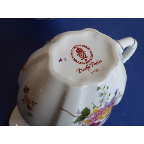 11 - A selection of Royal Crown Derby teawares in the 'Derby Posies' pattern; to include a large plate, a... 
