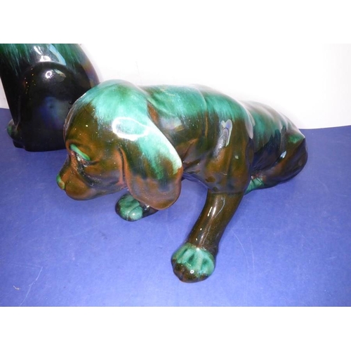 12 - Eight green glazed ceramic animals including dogs, a cat and an open-winged bird (the tallest 46.5cm... 