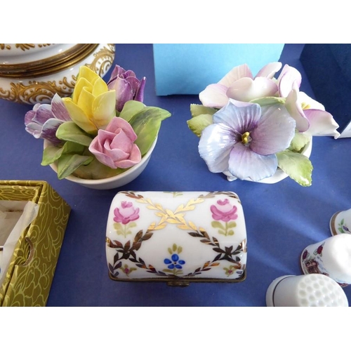 24 - A good selection of fine quality ornamental ceramics and bijouterie; to include ceramic boxes and an... 