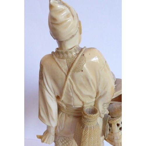240 - A very finely carved Japanese Meiji period ivory carving depicting a male figure holding a woven wic... 