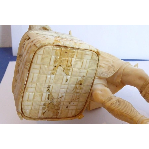 240 - A very finely carved Japanese Meiji period ivory carving depicting a male figure holding a woven wic... 