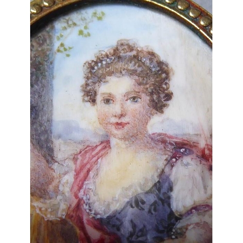 242 - A late 19th century portrait miniature of a young lady in a pinchbeck frame