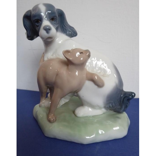 28 - Three Lladro and two Nao porcelain figures; the Nao figures of a girl in first communion dress (23cm... 