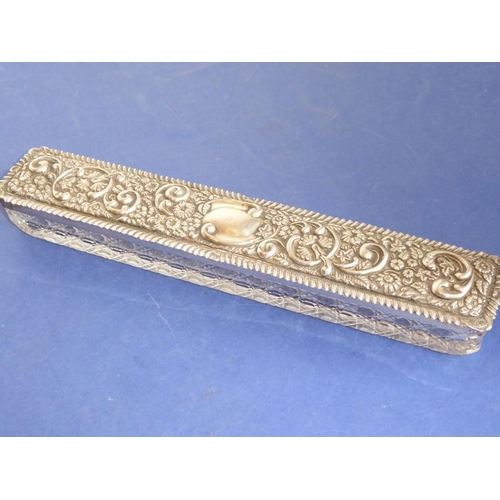 29 - A long rectangular cut-glass lady's dressing table requisite box having silver-mounted lid (small do... 