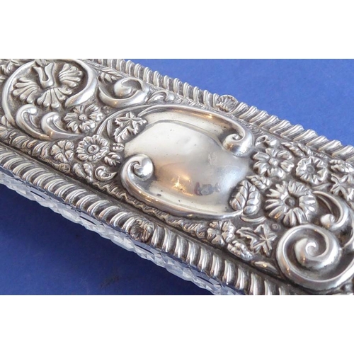 29 - A long rectangular cut-glass lady's dressing table requisite box having silver-mounted lid (small do... 