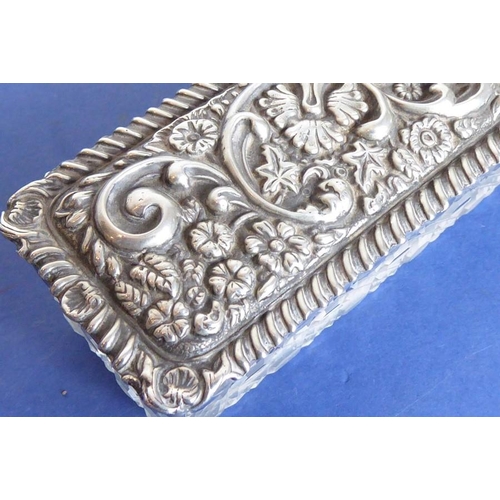29 - A long rectangular cut-glass lady's dressing table requisite box having silver-mounted lid (small do... 