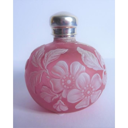 31 - A 19th century cameo glass perfume bottle by Thomas Webb of Stourbridge; heavy white floral decorati... 