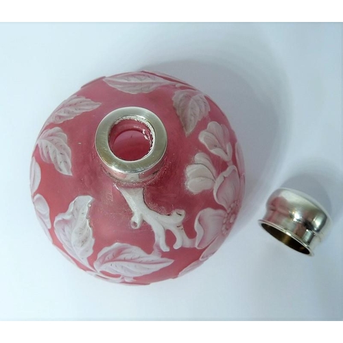 31 - A 19th century cameo glass perfume bottle by Thomas Webb of Stourbridge; heavy white floral decorati... 