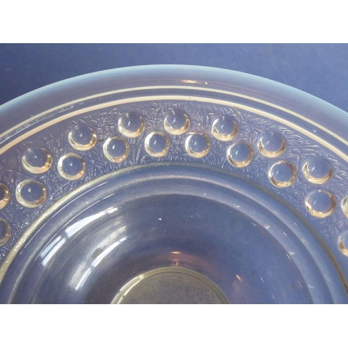 32 - A large and heavy Art Deco period circular glass bowl with opalescent rim and inner border of half s... 