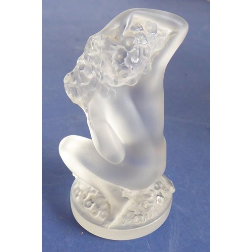 33 - A small frosted glass sculpture/paperweight modelled as a naked kneeling maiden with her long curly ... 