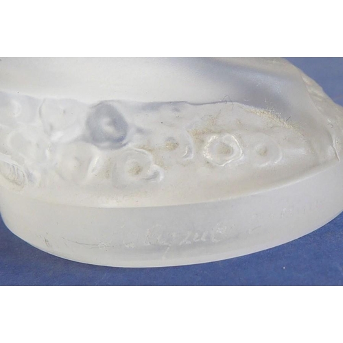 33 - A small frosted glass sculpture/paperweight modelled as a naked kneeling maiden with her long curly ... 