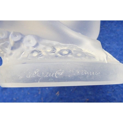 33 - A small frosted glass sculpture/paperweight modelled as a naked kneeling maiden with her long curly ... 