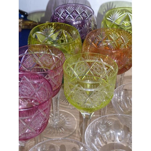 34 - A good selection of glassware to include a set of four flash-cut hock glasses together with three ot... 