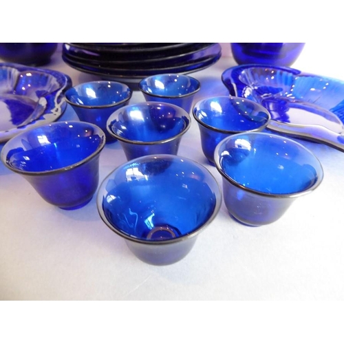 39 - A 25-piece cobalt-blue-glass service; (probably mid-20th century Chinese) comprising eight circular ... 