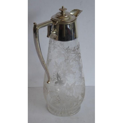 44 - A late 19th century baluster-shaped glass claret jug with silver-plated mounts; the main body very f... 