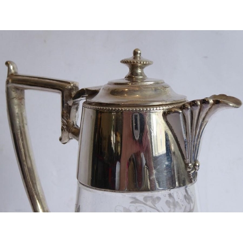 44 - A late 19th century baluster-shaped glass claret jug with silver-plated mounts; the main body very f... 