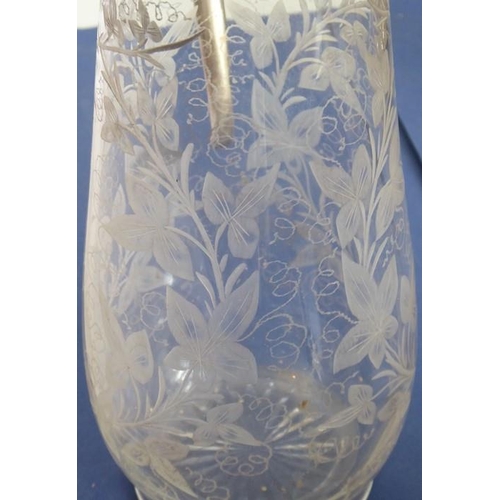 44 - A late 19th century baluster-shaped glass claret jug with silver-plated mounts; the main body very f... 