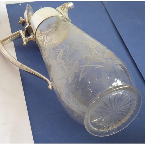 44 - A late 19th century baluster-shaped glass claret jug with silver-plated mounts; the main body very f... 