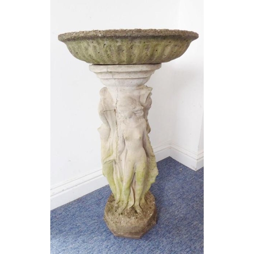 460 - A reconstituted stone bird bath on octagonal base; the separate circular weathered lobed top support... 