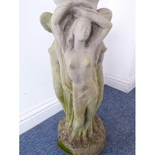 460 - A reconstituted stone bird bath on octagonal base; the separate circular weathered lobed top support... 