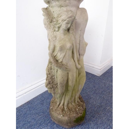 460 - A reconstituted stone bird bath on octagonal base; the separate circular weathered lobed top support... 