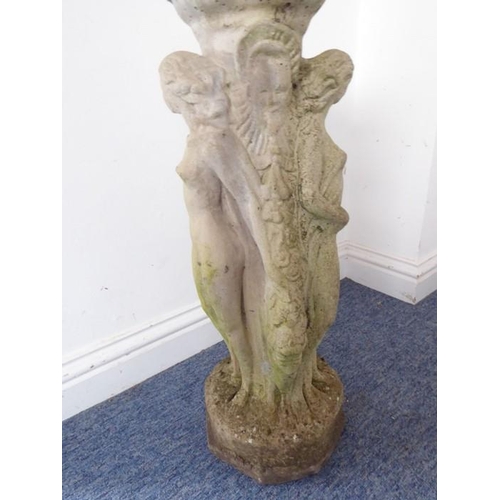 460 - A reconstituted stone bird bath on octagonal base; the separate circular weathered lobed top support... 