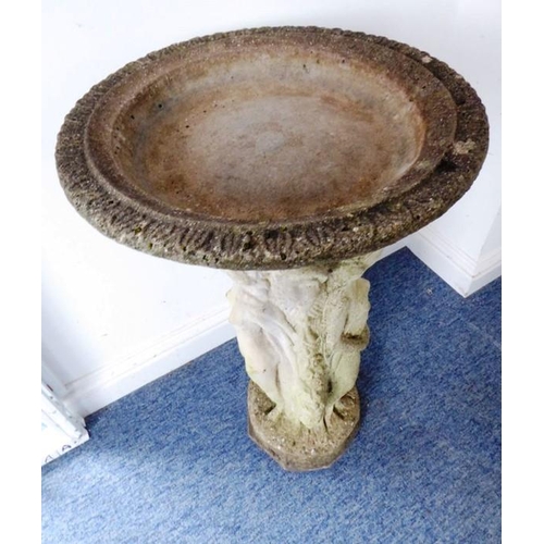 460 - A reconstituted stone bird bath on octagonal base; the separate circular weathered lobed top support... 