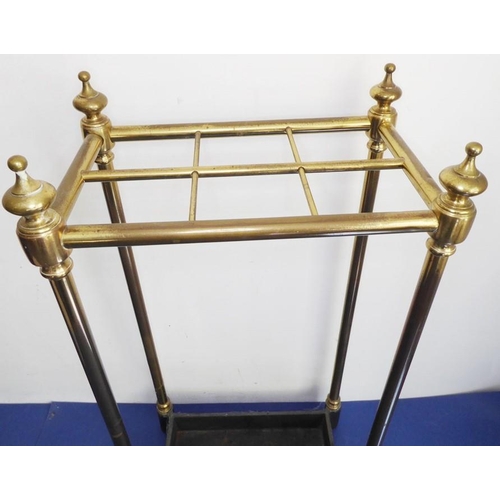 47 - An early 20th century six-division brass stick-stand with iron base (62cm high); together with two u... 