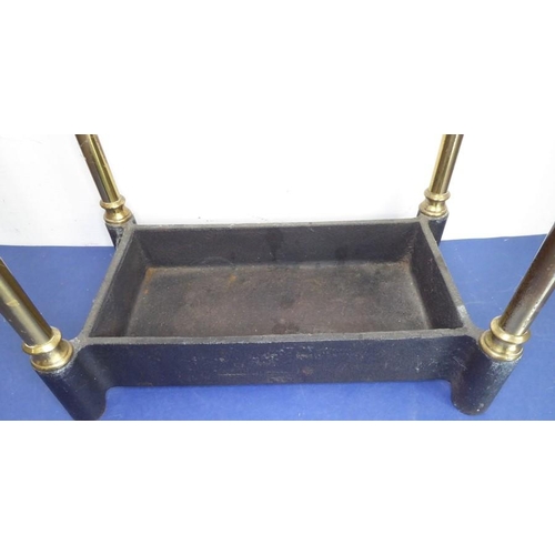 47 - An early 20th century six-division brass stick-stand with iron base (62cm high); together with two u... 