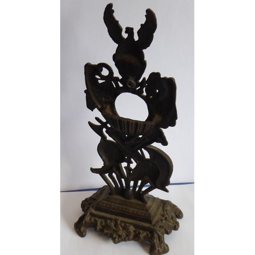 52 - A 19th century cast iron bronzed watch stand modelled as arms, armour, weaponry and battle helmets e... 