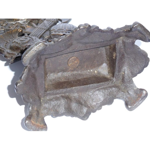 52 - A 19th century cast iron bronzed watch stand modelled as arms, armour, weaponry and battle helmets e... 